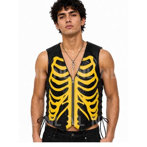 May include: Black leather vest with a yellow rib cage design. The vest has a zipper closure and lace-up sides. A unique and edgy fashion statement.