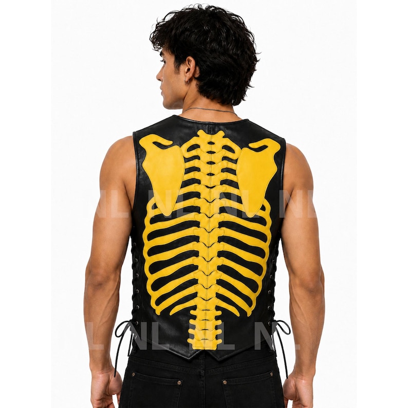 May include: Black leather vest with a yellow skeleton design on the back. The vest has a lace-up closure on the sides and a sleeveless design. The yellow skeleton design includes the rib cage and shoulder blades.