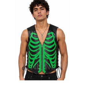 May include: Black leather vest with a green skeleton rib cage design. The vest has a zipper closure and lace-up sides. The model is wearing a silver necklace. The vest is sleeveless.