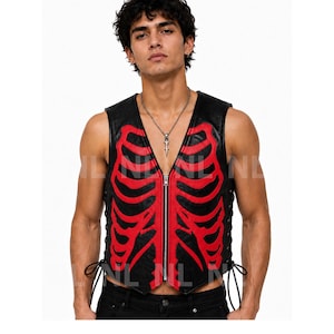 May include: Black vest with a red rib cage design. The vest has a zipper closure and lace-up sides. The vest is sleeveless and made of a leather-like material. The design is a bold statement piece.