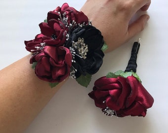 Maroon and Black Rose Corsage or Boutonnière with Greenery