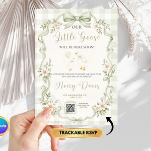 May include: A baby shower invitation card featuring a sage green gingham background, a decorative border with floral accents, and a bow at the top. The text reads: Our Little Goose Will Be Here Soon! Avery Davis, 123 Anywhere St., Any City, and a QR code.