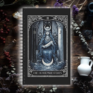 May include: Black spiral-bound notebook with a tarot card design on the cover. The card shows a robed figure with a crescent moon headdress, seated between pillars. The text "DIE HOHEPRIESTERIN" is at the bottom of the image.
