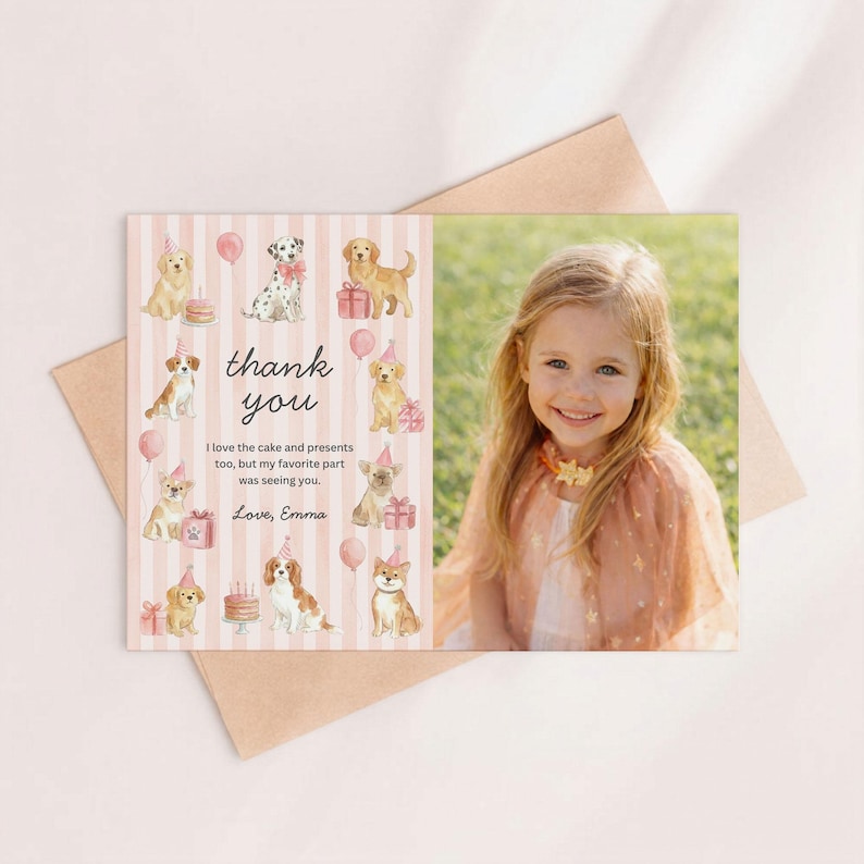 May include: A personalized thank you card featuring a photo of a smiling child. The card has a pink striped background with watercolor illustrations of dogs wearing party hats and holding gifts. The text reads "thank you" and a personal message.