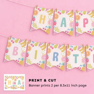 May include: A colorful banner with the words "HAPPY BIRTHDAY" printed on individual pennants. Each pennant is decorated with various fruits and the letters are in pastel colors. The banner is strung on a white string with small wooden clothespins.