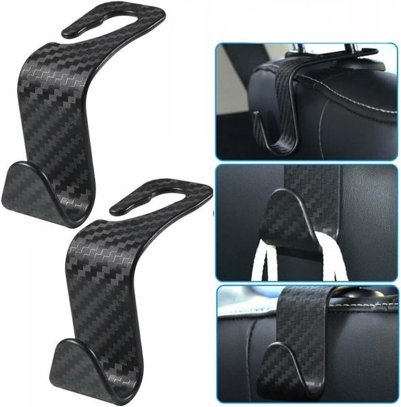 May include: Two black car seat headrest hooks with a carbon fibre pattern. The hooks have a curved design with a hook on each end. Additional images show the hooks in use, hanging from a car seat headrest.