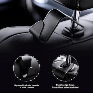 May include: Black car seat headrest hook. The hook is made of high-quality plastic material and has a smooth edge design. The text in the image says "High-quality plastic material is More Durable" and "Smooth edge design Prevent from being scratched."