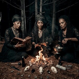 May include: Three people in black attire gather around a campfire in a forest. One reads a book, another stirs a bowl, and the third appears to be casting a spell. Skulls, candles, and runes surround the fire, creating a mystical scene.
