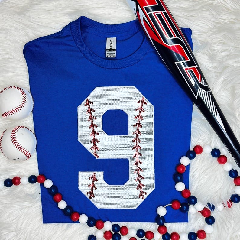 Baseball Number Sequin Patch, blue t-shirt with a large white number 9 featuring red baseball stitching details.