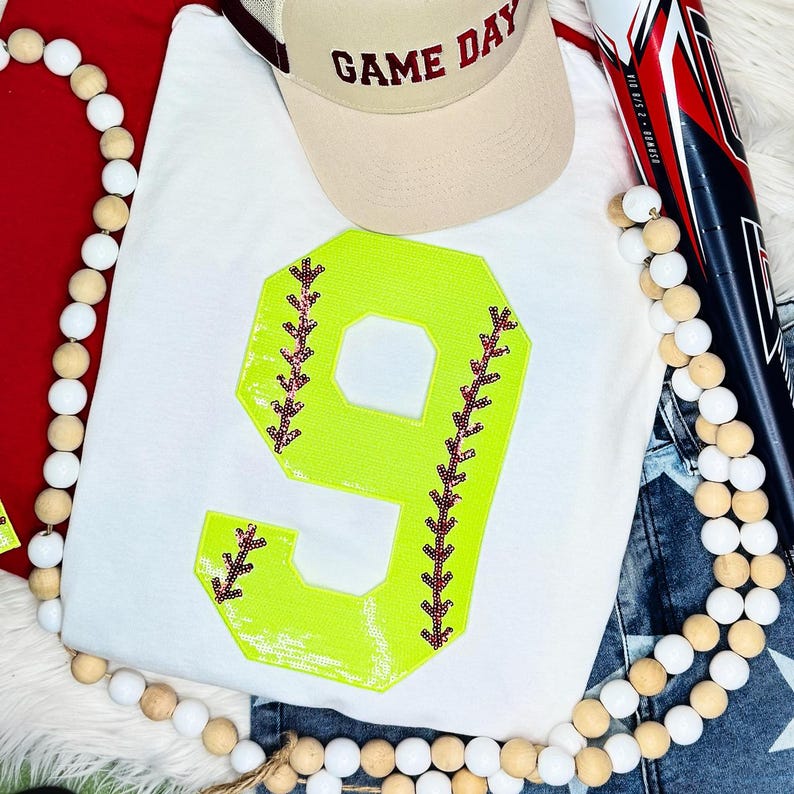 Softball Number Sequin Patch, bright yellow sequined number 9 with red stitching details.