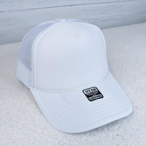 White Foam Trucker Hat, a stylish white trucker hat with foam front and mesh back for breathability.