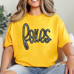Foxes Sequin Patch, close-up of a yellow T-shirt featuring a stylish 'foxes' sequin patch design.