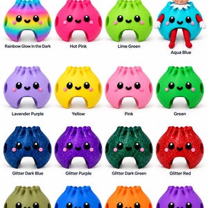 May include: A collection of sixteen silicone dumpling-shaped figures with smiling faces, arranged in four rows. Colours include rainbow, hot pink, lime green, aqua blue, lavender, yellow, pink, green, glitter blue, purple, green, red, olive, blue, orange, and purple.