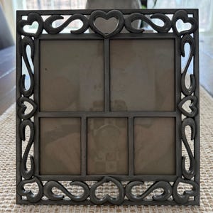 Vintage silverfärgad metallrulledesignram