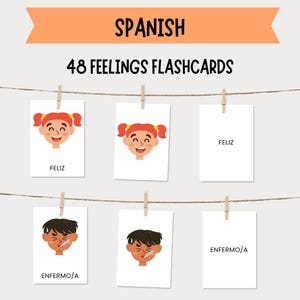 May include: A display of 48 Feelings Flashcards in Spanish, hanging from a string with clothespins. The cards feature illustrations of children expressing emotions like happiness and sickness, with corresponding Spanish words.