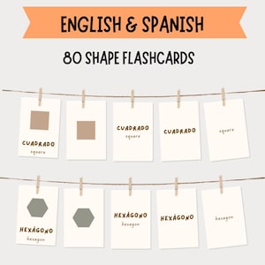 May include: A set of 80 shape flashcards in English and Spanish. The cards are displayed on a string with clothespins. The cards feature shapes like squares and hexagons, with the shape name in both languages.