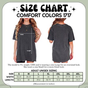 May include: A size chart for a Comfort Colors 1717 t-shirt, showing front and back views of a charcoal grey shirt. The chart displays width and length measurements in inches for sizes S through 4XL, with labels indicating width and length.