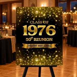 May include: A rectangular black sign featuring gold text that reads CLASS OF 1976 50th REUNION and HOLYOKE HIGH SCHOOL on a gold ribbon. The design includes a pattern of gold stars and light beams against a dark background, displayed on a stand.
