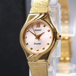 Vintage Orient Smaddy Womens Watch, 2000s, Minimalist Quartz, Ref. UB8Z-N0, Pink Sunburst Dial, 18mm Gold Tone, Near MINT from Japan