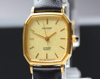 Relógio feminino Citizen Exceed vintage, 1986, quartzo minimalista, Ref. 2930-291441, caixa octogonal de 20 mm em tom dourado, em estado quase impecável, importado do Japão.