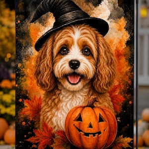 May include: A rectangular garden flag featuring a watercolor-style illustration of a brown and white dog wearing a black witch hat. The dog is positioned above a carved orange jack-o'-lantern pumpkin surrounded by red and orange autumn leaves.