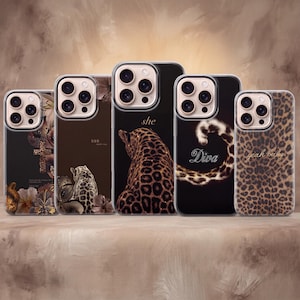 May include: Five clear phone cases featuring various designs: a leopard print cross with flowers, a leopard sitting with the text 555, a leopard back with the text she, a leopard tail forming a circle with the text Diva, and a full leopard print with the text yeah baby.
