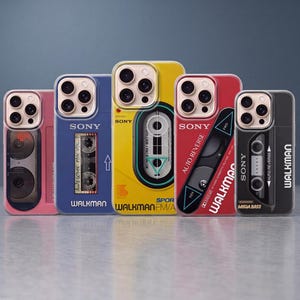 May include: Five smartphone cases featuring retro Sony Walkman designs. The cases are pink, blue, yellow, red, and black, each displaying cassette player graphics, Sony branding, and Walkman text. The designs include details like cassette reels, buttons, and labels.