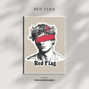 May include: A framed print with a black and white illustration of a classical bust, adorned with a red blindfold and a floral crown. The words "Red Flag" are printed in black below the bust.
