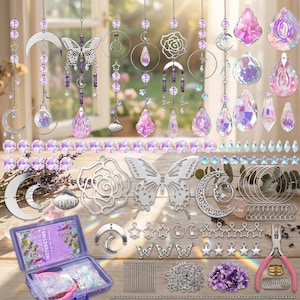 May include: A suncatcher making kit featuring various silver-toned metal charms including moons, stars, butterflies, and roses, alongside purple and iridescent crystal beads, teardrop prisms, jump rings, eye pins, a storage box, and jewelry pliers.