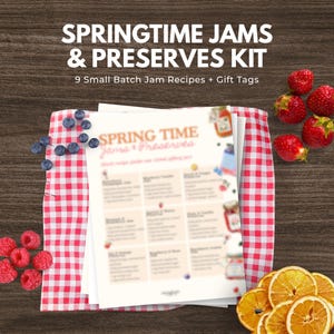 May include: A kit for making springtime jams and preserves. The image shows a stack of recipe sheets with the text "SPRINGTIME JAMS & PRESERVES KIT" and "SPRING TIME Jams & Preserves". Fresh strawberries, blueberries, raspberries, and dried orange slices are also visible.
