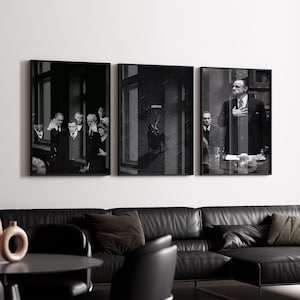 May include: Three framed monochrome prints. The prints show figures in suits, with one featuring the word "patience". The prints are displayed above a black leather sofa, creating a stylish interior.