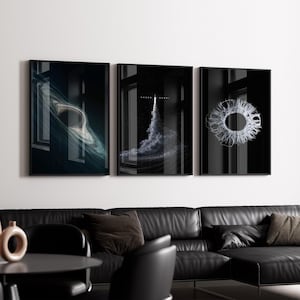 May include: A white ceramic mug with a black handle and the text "But First, Coffee" in a black, handwritten-style font. The mug is on a white surface.