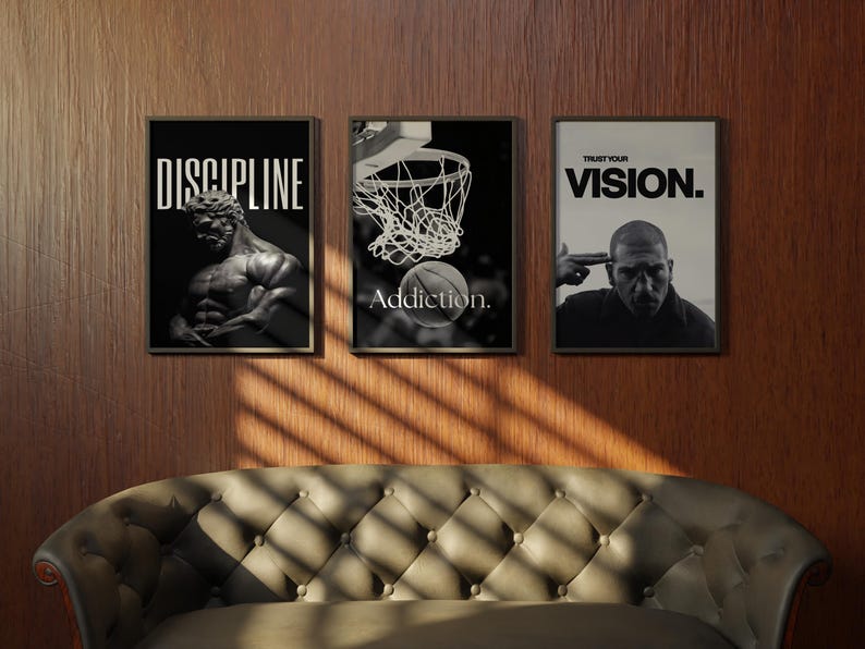 May include: Three framed black and white motivational posters. The first reads "DISCIPLINE" above a statue. The second shows a basketball going into a hoop with the word "Addiction." The third says "TRUST YOUR VISION."