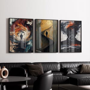 May include: Set of three framed art prints. Each features a person in a surreal landscape. One shows a figure in a swirling vortex of colors, another on a spiral staircase, and the third a silhouette with an abstract background.