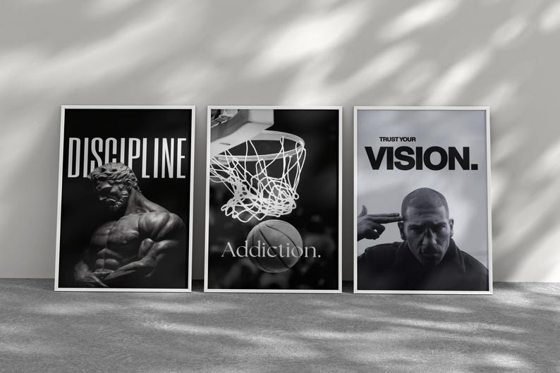 May include: Three framed black and white motivational posters. The first says "DISCIPLINE" with a statue. The second shows a basketball going into a hoop with the word "Addiction." The third says "TRUST YOUR VISION."