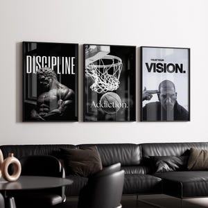 May include: Three framed black and white wall art pieces. The first features a muscular statue with the word "DISCIPLINE". The second shows a basketball going into a hoop with the word "Addiction". The third has a man pointing at his head with the words "TRUST YOUR VISION."