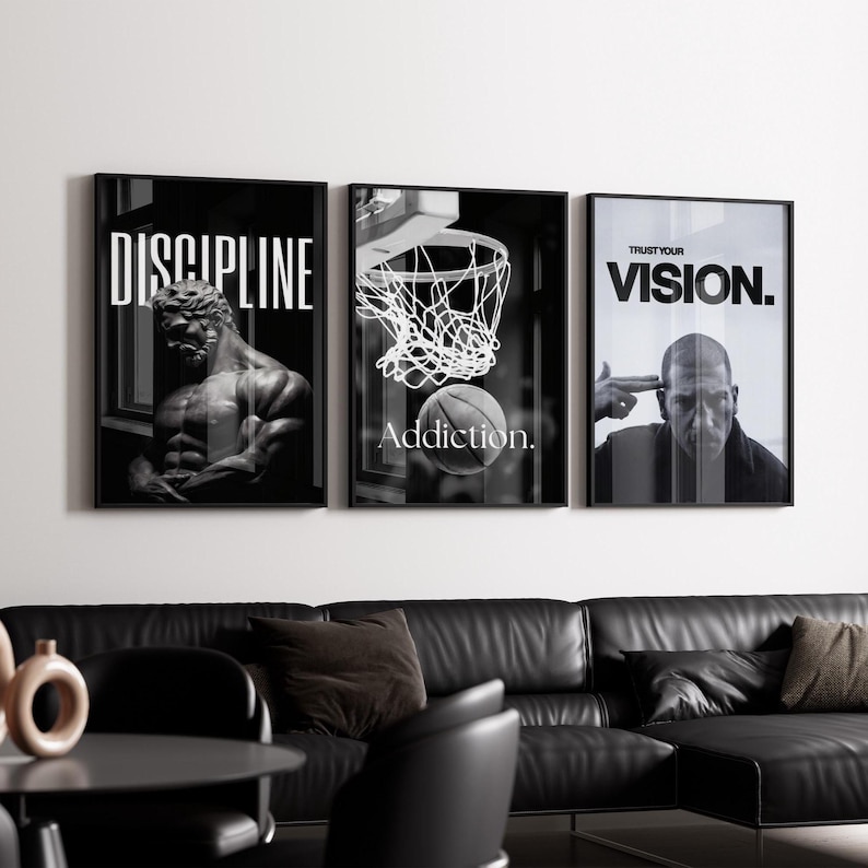 May include: Three framed black and white wall art pieces. The first features a muscular statue with the word "DISCIPLINE". The second shows a basketball going into a hoop with the word "Addiction". The third has a man pointing at his head with the words "TRUST YOUR VISION."