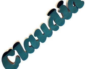 Letrero de escritorio CLAUDIA en azul aguamarina y madera, placa de 25 x 5 cm.