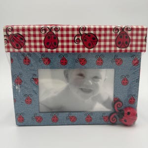 May include: A set of three ceramic mugs with a speckled, matte finish. Each mug features a different color: light blue, cream, and gray. The mugs have a simple, modern design and a comfortable handle.