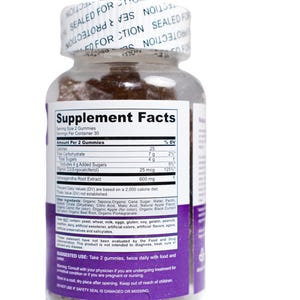 May include: A clear plastic bottle of gummies with a white label and purple accents. The label displays "Supplement Facts" and ingredient information. The bottle is sealed with a white cap that reads "SEALED FOR PROTECTION".