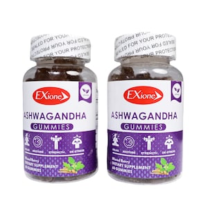 May include: Two clear plastic bottles of Exione Ashwagandha Gummies. Each bottle has a white label with purple accents and the words "Ashwagandha Gummies" in large text. The bottles are filled with dark brown gummies and sealed with a white cap.