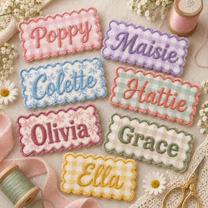 May include: Seven rectangular embroidered patches with scalloped edges, each featuring a name in cursive script: Poppy, Maisie, Colette, Hattie, Olivia, Grace, and Ella. The patches have gingham or floral patterns in pink, purple, blue, green, and yellow.
