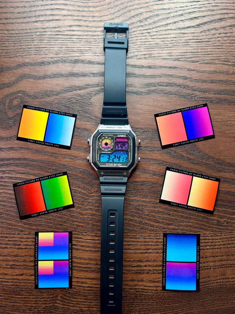 May include: A digital Casio watch with a black band and silver face, displaying the time 3:24:13. The watch is surrounded by six small cards with colorful gradient designs and the text "CASIO FILTERS BY KLOKK.ETSY.SHOP" and "CUT ALONG BLACK LINES".
