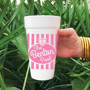 May include: A white foam cup with pink and white stripes and the text "The Benton Pool Est. 2024" in a pink oval.
