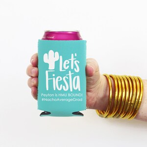 May include: A turquoise can cooler with a white cactus and the text "Let's Fiesta" and "Peyton is HMU BOUND! #NachoAverageGrad".
