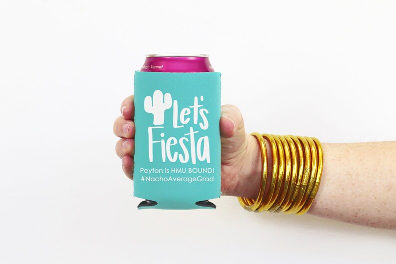 May include: A turquoise can cooler with a white cactus and the text "Let's Fiesta" and "Peyton is HMU BOUND! #NachoAverageGrad".