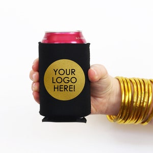 May include: Black neoprene can cooler with a gold circle that says "YOUR LOGO HERE!"