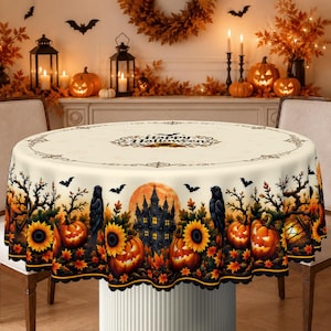 Cream rectangular holiday tablecloth printed with central "Happy Halloween" typography, framed by detailed gothic sunflowers, black ravens, and spooky harvest pumpkin illustrations.
