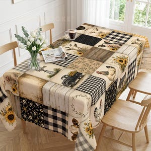 May include: A rectangular tablecloth featuring a patchwork design of farm-themed illustrations including sunflowers, cows, goats, chickens, windmills, and trucks, interspersed with black and white buffalo check and wood grain patterns.