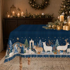 May include: A rectangular tablecloth featuring a dark blue plaid pattern and a festive border print. The design displays a nativity scene with figures, various animals including sheep, a goat, and a deer, alongside evergreen trees and stars.